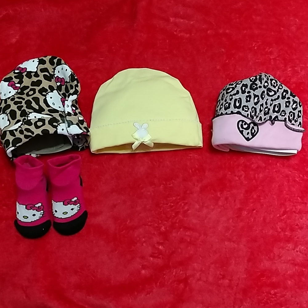 Set of baby hats and a pair of matching socks